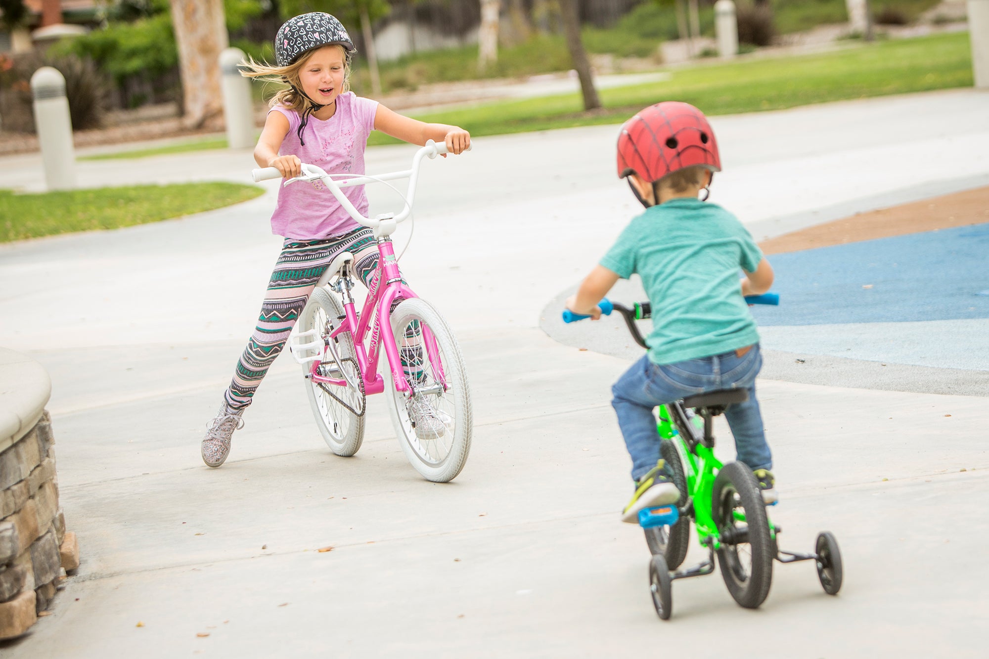 Kids riding bikes in a park